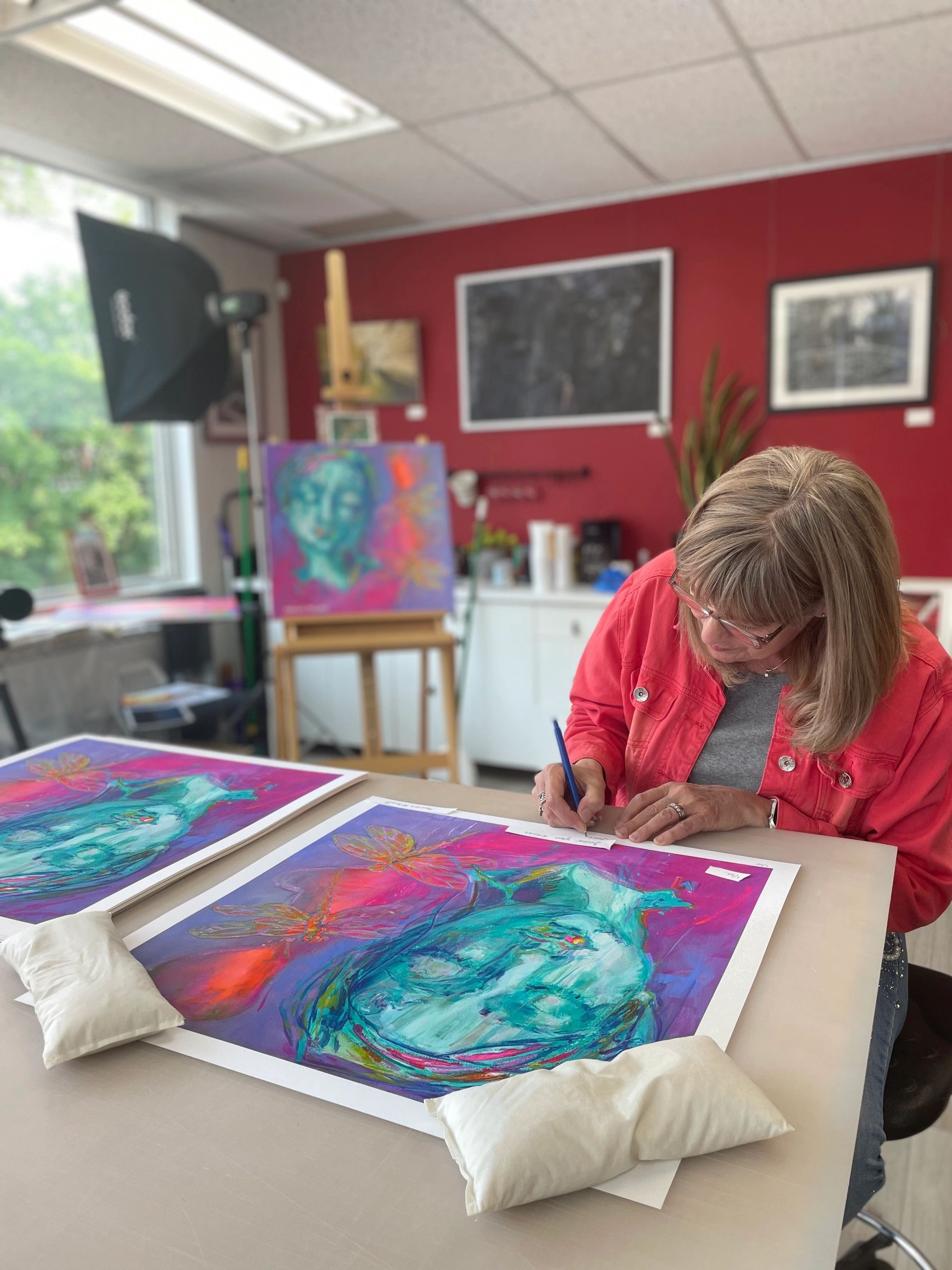 Couple enjoying a paint date session at the gallery